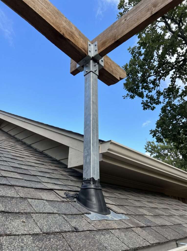 Heavy duty structural roof bracket extending through shingles to hold an elevated pergola beam.