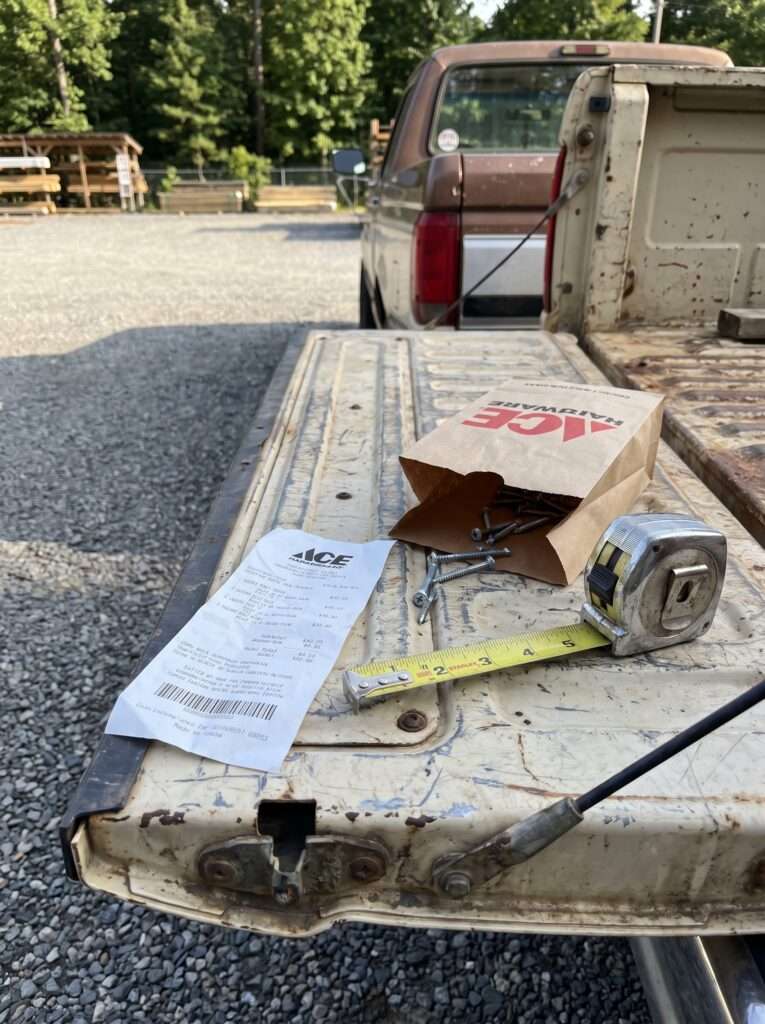 Hardware store receipt and tools after buying trash enclosure supplies